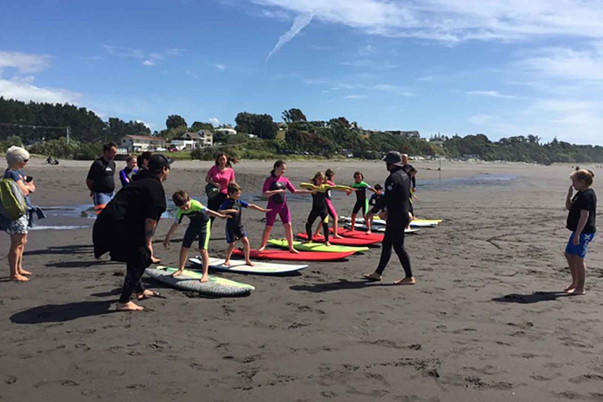 The Vertigo team running surf lessons at Oakura beach